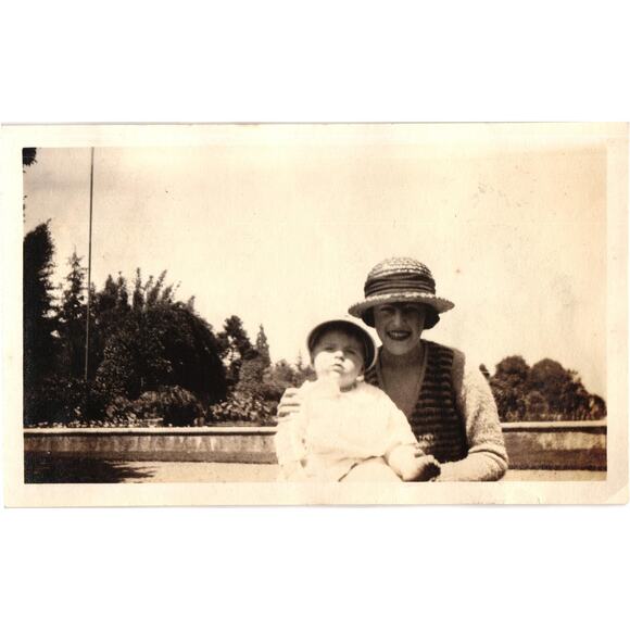 Vintage Snapshot Woman With Baby Wearing Hats Outdoor Park Setting - Picture 1 of 2